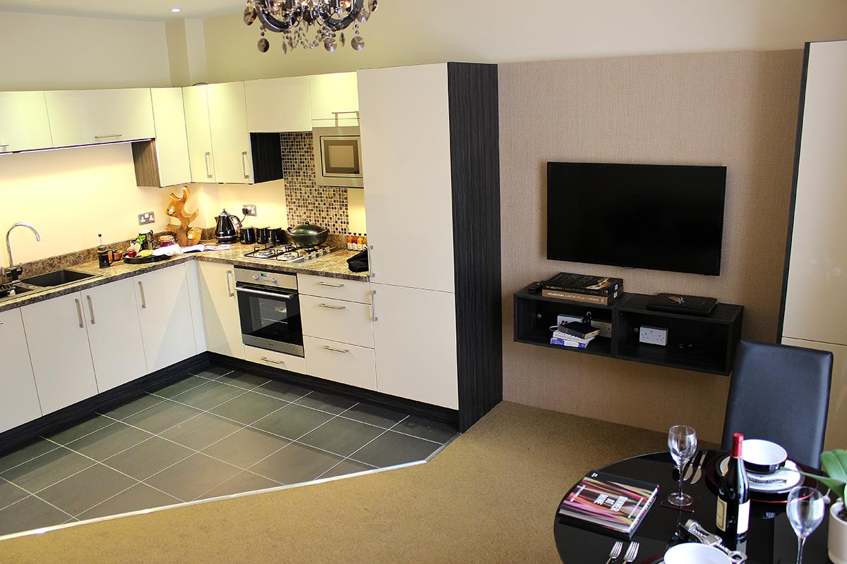A photo of the open plan ground-floor long let apartment kitchen and living area